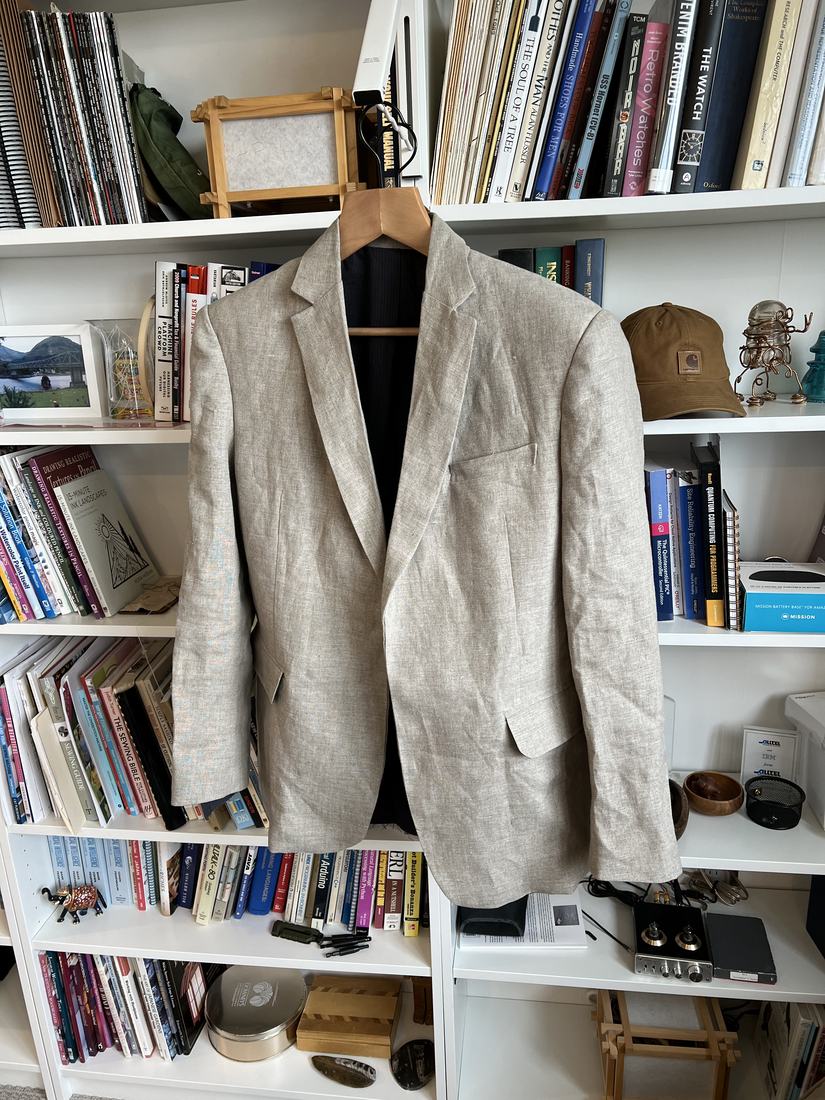 The linen jacket hanging complete with sleeves attached.